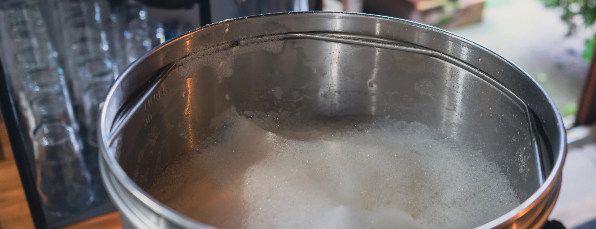 Looking into the Dahoam1516 Brewhouse kettle, foam rising on a fresh batch
